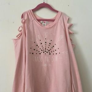 chase the sun sweatshirt with rips in the sleeves.